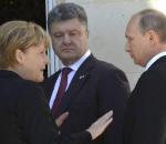 Bundeskanzlerin Angela Merkel mit dem ukrainischen Prsidenten Petro Poroschenko und dem russischem Prsidenten Wladimir Putin Foto: picture alliance / dpa